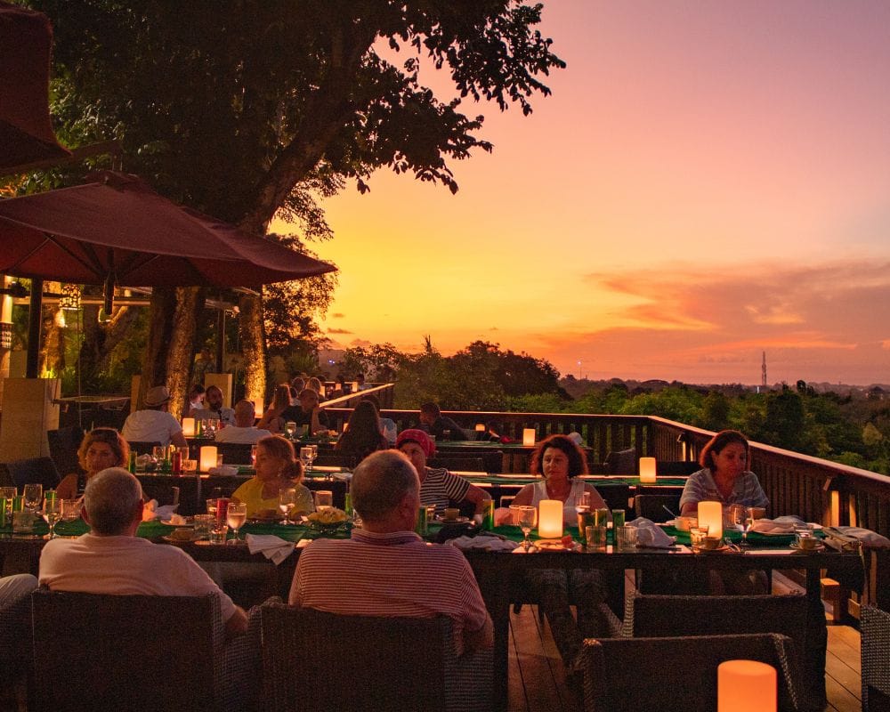 Sunset in Bali from a Different Perspective: City Lights from a Height at the Window of Bali Restaurant